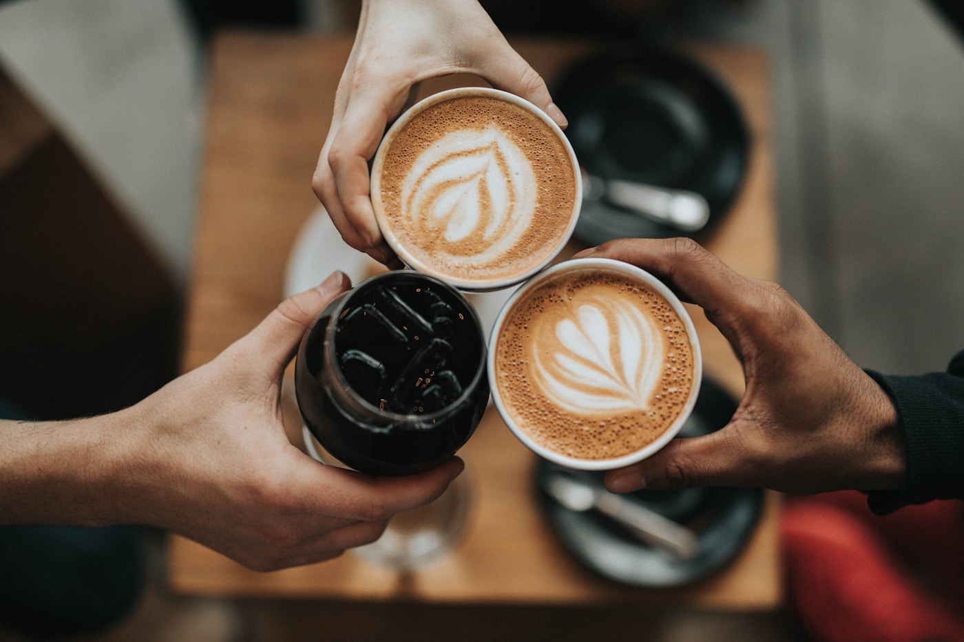 A carefully prepared cup of coffee on a wooden table