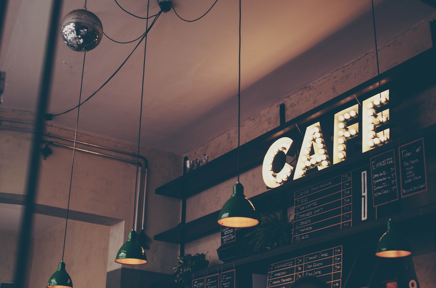 A barista working behind a cafe counter